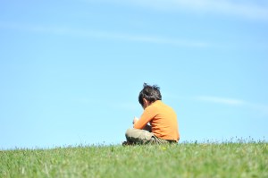 boy-sitting-alone-120123